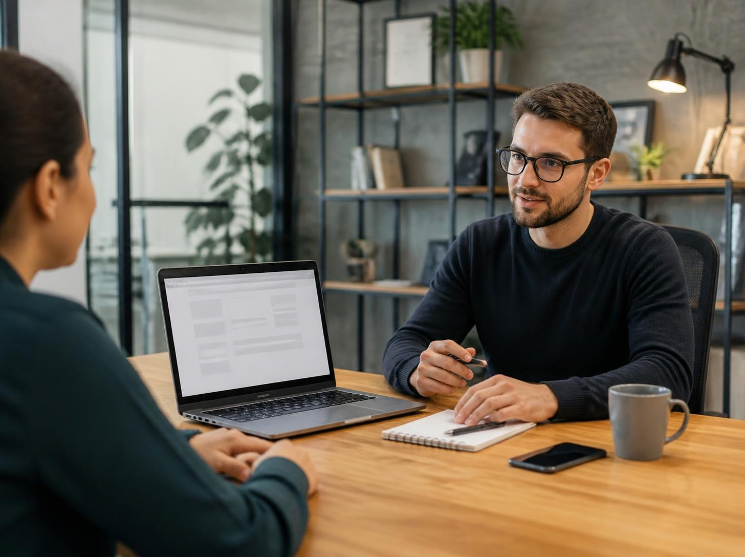 Consultant discussing a website project with a client